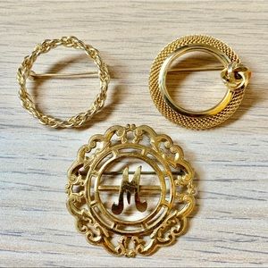 Three vintage gold circle brooches